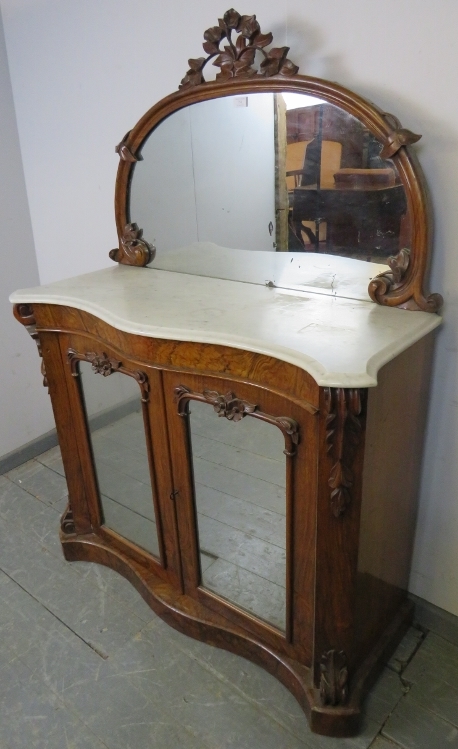 A Victorian walnut serpentine fronted chiffonier, the mirror back with foliate carved cornice and - Image 2 of 3