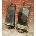 A pair of 19th century Italian gilt gesso wall mirrors in ornate surrounds depicting scrolling