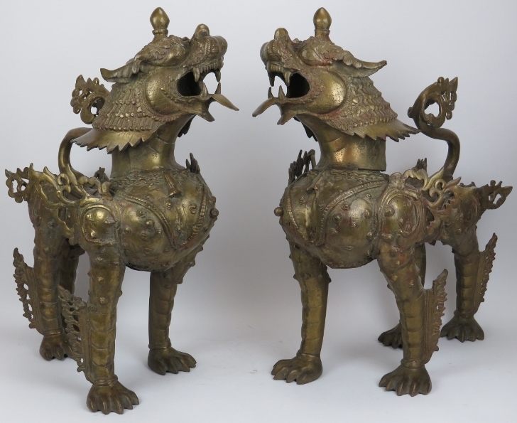 A large pair of Chinese bronze armoured dogs. (2 items) 22.8 in (58 cm) height. Condition report: