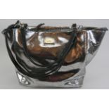 A large Paul Costelloe handbag with silver crackle metallic decoration and added shoulder strap,