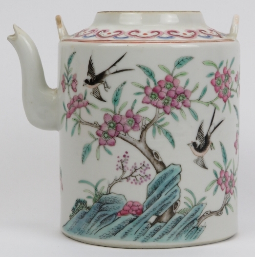 A Chinese famille rose teapot, 19th century. Finely overglaze enamel painted depicting birds amongst