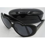 Moschino black heart shaped sunglasses, cased. Provenance: Part of a private collection of