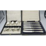 A set of six silver handled tea knives, Sheffield 1925, and a set of white metal teaspoons, hand
