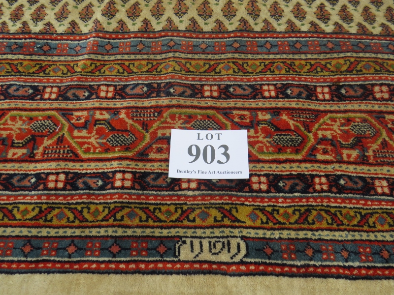A 20th century Persian rug with central block pattern on cream ground. Condition and colour good.