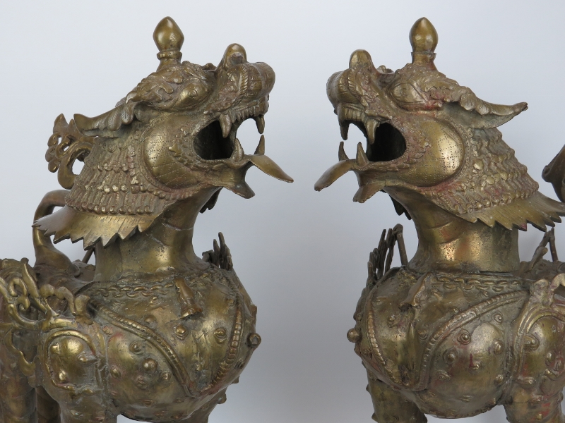 A large pair of Chinese bronze armoured dogs. (2 items) 22.8 in (58 cm) height. Condition report: - Image 2 of 4