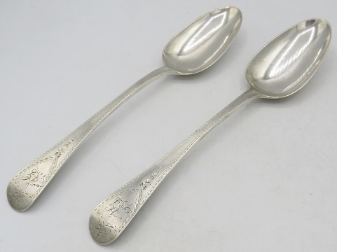 A pair of Georgian bright cut silver table spoons, London 1831, probably William Southey. Approx