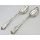 A pair of Georgian bright cut silver table spoons, London 1831, probably William Southey. Approx