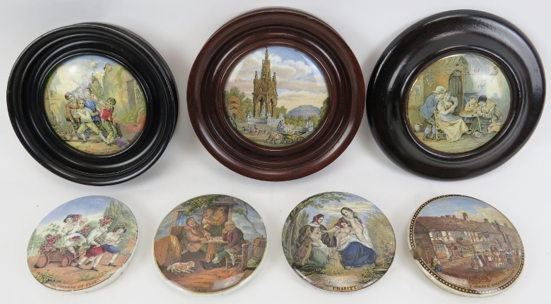 A collection of pratt ware pot lids, 19th century. (7 items) Three later in later frames. Albert