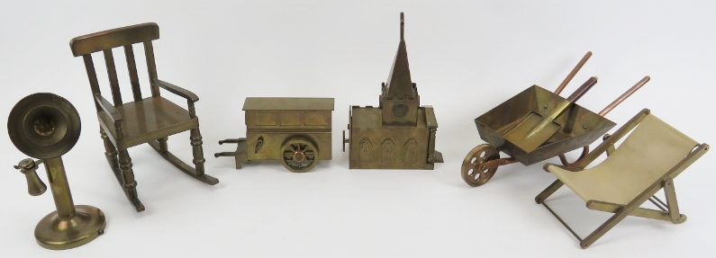 A collection of brass and copper miniature and mechanical music objects. Comprising a brass