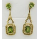 Peridot earrings, emerald & round cut faceted stone of good cut and clarity, post back, 34mm drop.