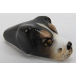 A Royal Worcester dogs head whistle. The hunting dog with painted features and Royal Worcester
