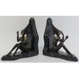 A pair of Art Deco bronze and black variegated marble book ends modelled after Josef Lorenzl. The
