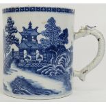 A Chinese export blue and white porcelain tankard, late 18th century. With a dragon moulded