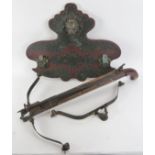 A Oriental crossbow and wall mounted rack, 20th century. An additional limb included. Rack: 25.2