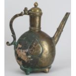 A Mughal Indian engraved brass ewer, 18th century. Of bulbous form with a hinged cover and supported