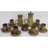 A St Ives studio pottery set of six coffee set by John Buchanan, dated 1972. Comprising six cups and