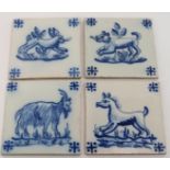 A set of four Dutch Delft blue and white ceramic tiles, 19th century. Depicting a variety of animals