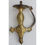 A Mughal Indian gold damascened metal tulwar sword hilt, 17th century.