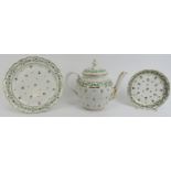 An early Worcester Chamberlain gilt and enamel decorated porcelain teapot and two saucers, late 18th