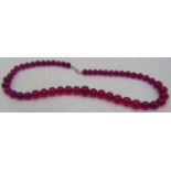 Pink onyx necklace, graduated polished beads, largest 14mm. 20" length. Condition report: Good