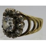 A fine late Georgian 18ct yellow gold diamond cluster ring. Silver collet set with a cushion