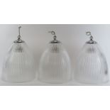 Three vintage holophane glass lampshades, 20th century. Of domed, opal ribbed form with chrome