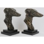 A pair of bronzed metal greyhound racing dogs head busts, 20th century. Modelled in the Art Deco