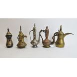 A group of five small Middle Eastern metalwork ewers. (5 items) 9.7 in (24.5 cm) tallest height.