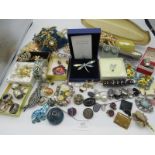 A large collection of mainly costume jewellery to include a boxed Swarovski dragonfly brooch, a