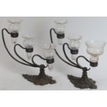 A pair of F & C Osler cast metal and glass three branch epergnes, circa 1900. Each epergne