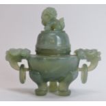A Chinese carved celadon jade twin handled tripod censer, 20th century. 5.1 in (13 cm) height.