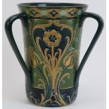 A William Moorcroft Macintyre green and gold Florian Ware three handled vase, circa 1903. Tubeline