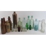 An antique and vintage collection of glass bottles, 19th century and later. (22 items) 11.2 in (28.5