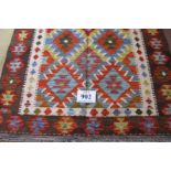 A Chobi Kilim rug. Good strong colours and in very good condition. 158cm x 109cm.