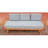 A mid-century blonde elm and beech Windsor daybed by Ercol with loose cushions reupholstered in teal