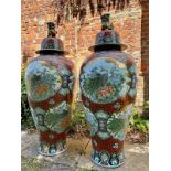 A pair of very large Chinese ceramic vases with covers, 20th century. The lids modelled as