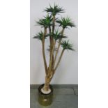 An artificial yucca plant in a Regency style brass planter with cast lion mask handles. H140cm (