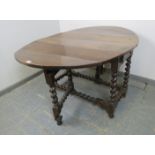 A late 17th/early 18th century oak oval gate-leg table, with single drawer to either side, on barley