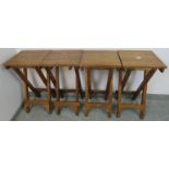 A set of four good quality folding teak bar stools. H76cm W40cm D40cm (approx). Condition report: