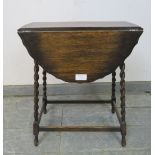 A diminutive antique oak oval drop-leaf side table, on canted barley twist supports with stretchers.