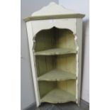 A pine wall-hanging corner shelving unit, of three open fitted shelves, painted distressed Annie