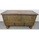 An antique camphorwood Zanzibar chest, decorated with an abundance of brass studs and pierced copper