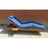 An adjustable teak steamer pool lounger with detachable drinks tray and loose seat squab cushions,