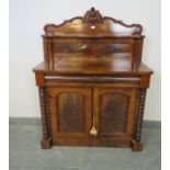 A Victorian mahogany chiffonier, with barley twist uprights, housing one long blind drawer above