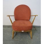 A mid-century blonde elm open-sided armchair by Ercol (model 305) with loose seat cushions re-