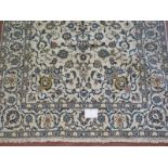 A Persian Yazd carpet, cream ground detailed with foliage and in very good condition. 252cm x 150cm.