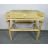 A vintage elm butcher’s block of great character, on an associated pine stand. H92cm W92cm D62cm (