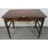 A Georgian mahogany side table, housing two short drawers with brass bail handles, on tapering