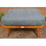A mid-century blonde elm and beech Windsor footstool by Ercol (model 341) with loose cushion