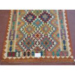 A fine Anatolian Turkish Kilim rug, vibrant colours and in good condition. 193cm x 120cm.